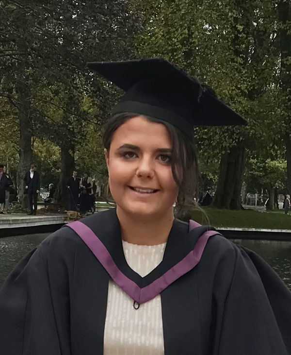 Ellis Baker at her graduation, wearing cap and gown